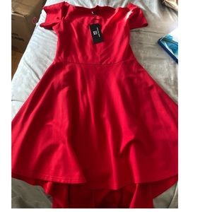 Brand new worn once red shirt in the front long short tail in the back